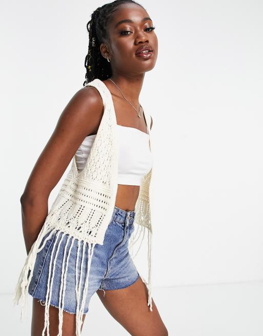 ASOS DESIGN crochet sleeveless festival cardigan with fringe in cream