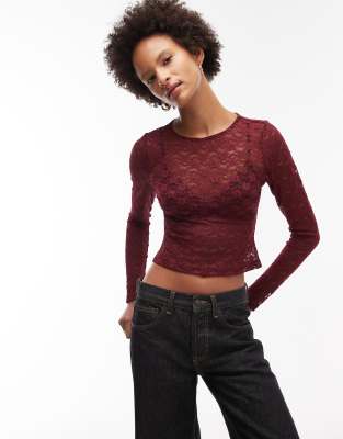 ASOS DESIGN - Crop top en dentelle transparente avec manches longues - Bordeaux-Rouge