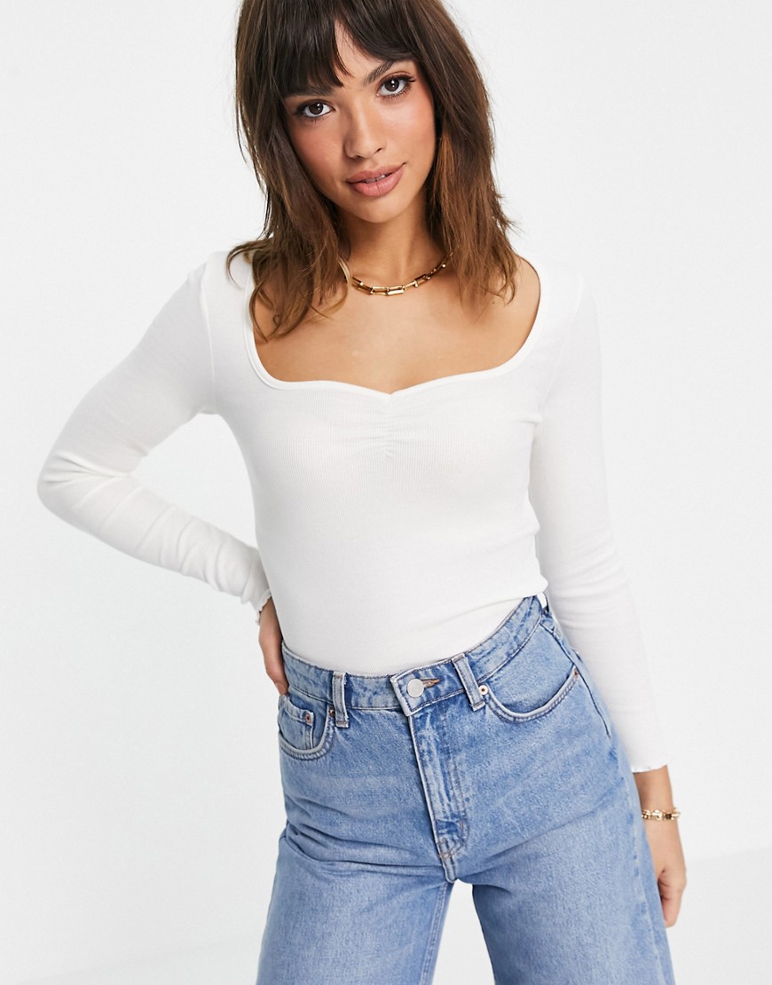 ASOS DESIGN crop top with sweetheart neck and lettuce hem in cream-White