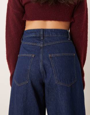 ASOS DESIGN cropped barrel leg jean with snap details in indigo