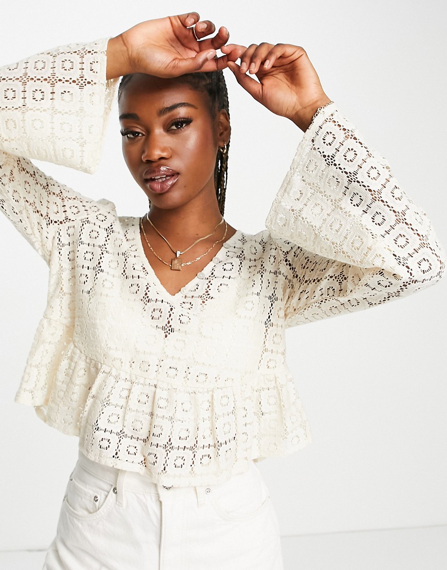 ASOS DESIGN cropped long sleeve crochet top with peplum hem in cream-White