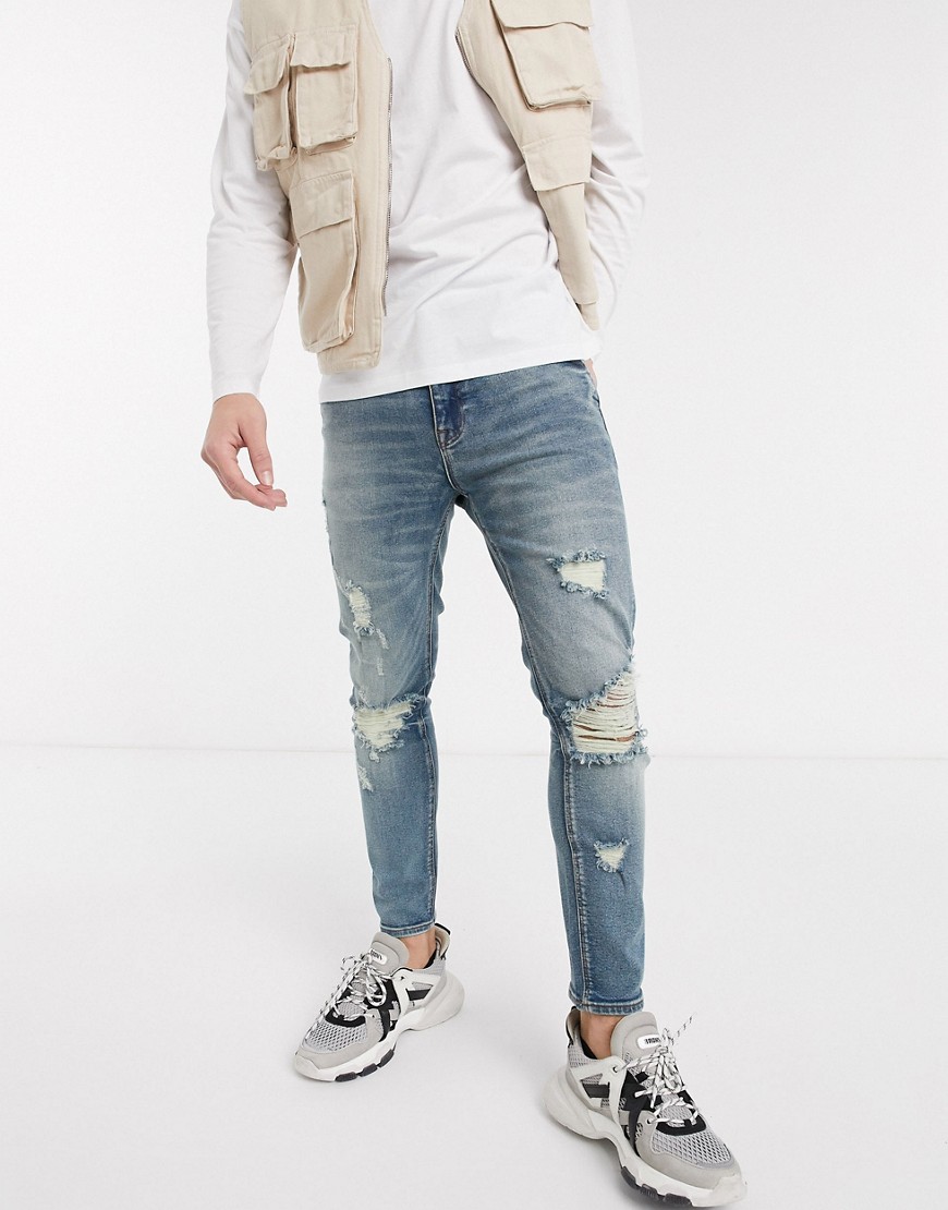 ASOS DESIGN - Cropped mellemblå skinny-jeans med kraftig slidtage