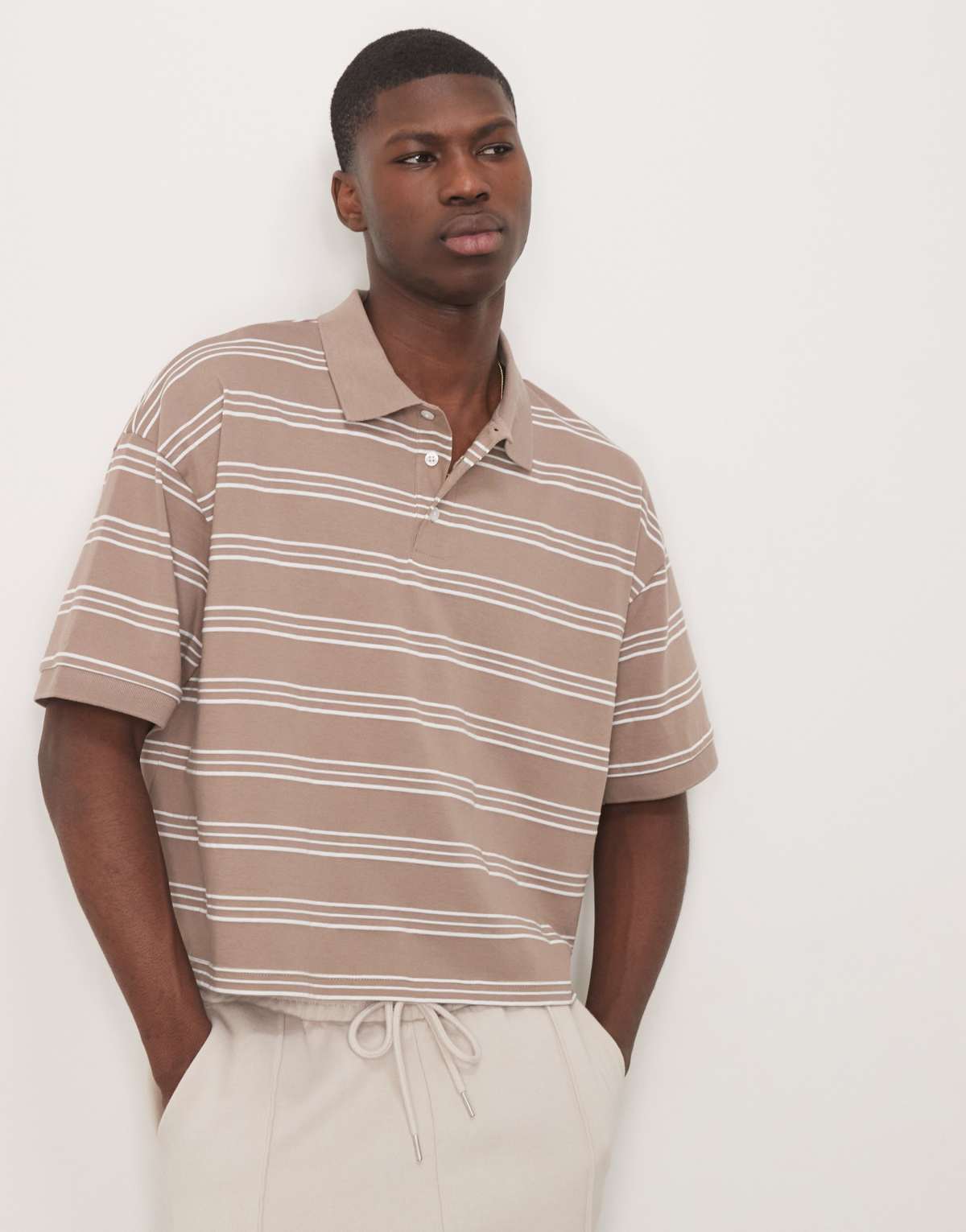 ASOS DESIGN cropped oversized polo in beige stripe