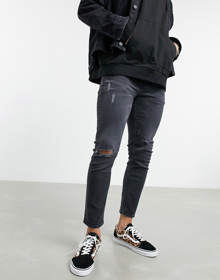 ASOS DESIGN - Cropped skinny jeans met scheuren in zwart met waterbesparende 'less thirsty' wassing
