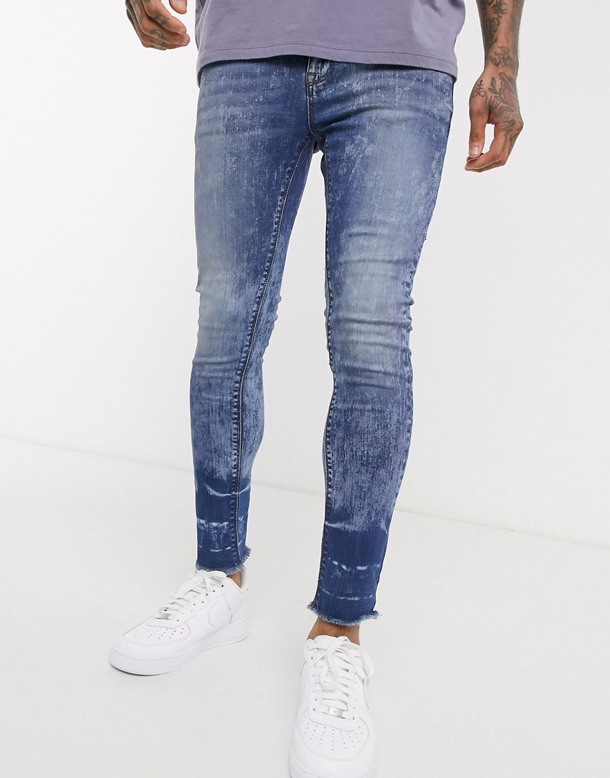ASOS DESIGN cropped super skinny in mid wash with faded raw hem-Blue