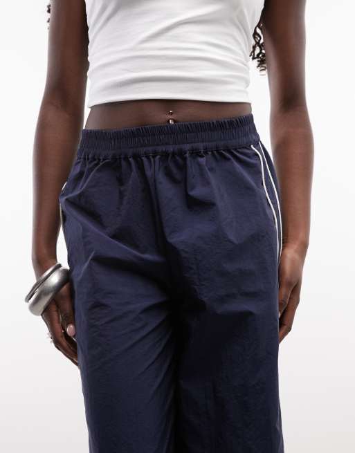 ASOS DESIGN cropped trackbroek in marineblauw met ecrukleurige bies, 3 van 5
