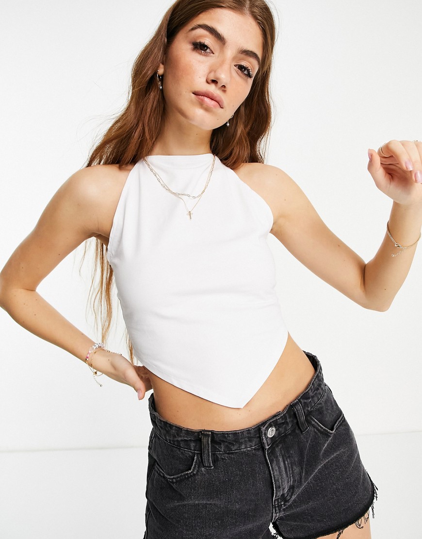 ASOS DESIGN cross back cami with skinny strap and handkerchief hem in white