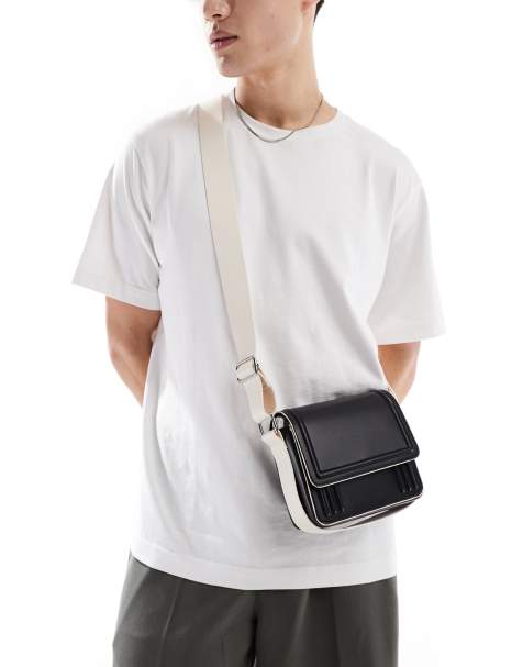 ASOS DESIGN cross body bag in black with contrast ecru strap and piping - view 1