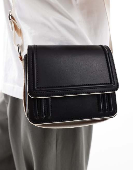 ASOS DESIGN cross-body bag in black with contrast ecru strap and piping