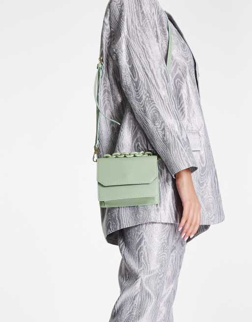 ASOS DESIGN cross body bag with resin top handle chain and detachable strap in sage green