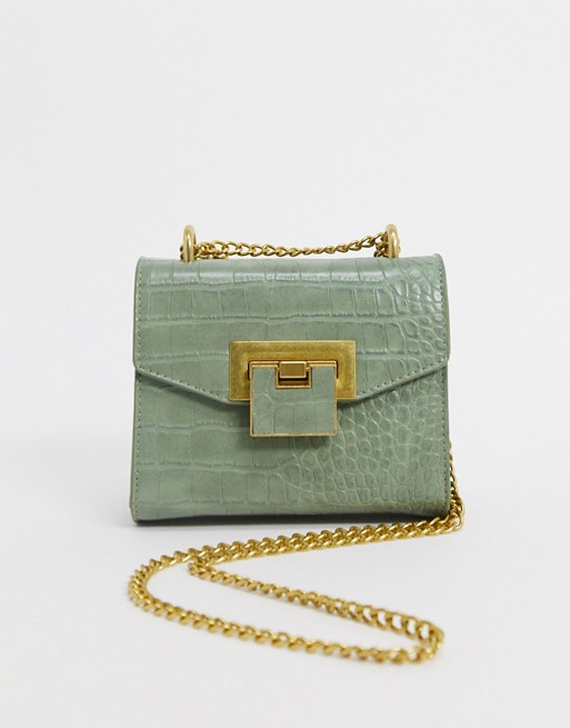 ASOS DESIGN cross body bag with shoulder strap in green croc with hardware detail