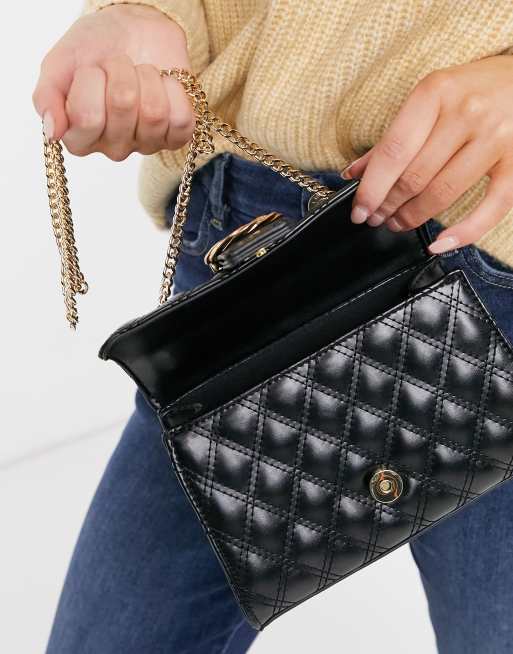 ASOS DESIGN cross body bag with twisted buckle in black quilt, 4 of 4