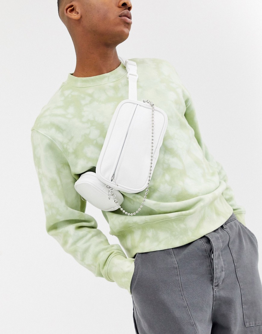 ASOS DESIGN cross body bum bag in white faux leather with multi pockets and chain detail