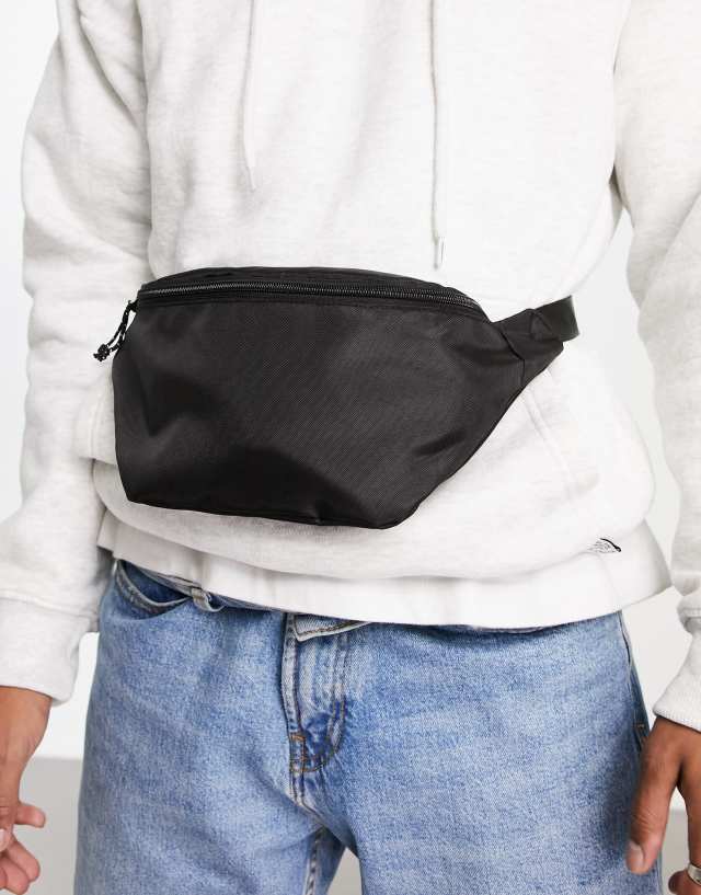 ASOS DESIGN cross body fanny pack in black nylon with contrast pullers