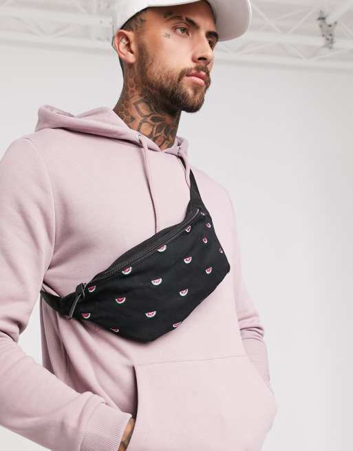 ASOS DESIGN cross body fanny pack in black with all over embroidery