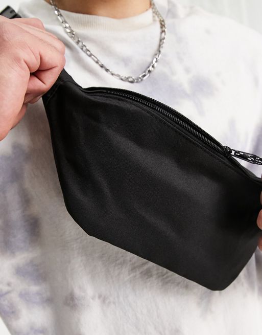 ASOS DESIGN cross body fanny pack with contrast puller in black