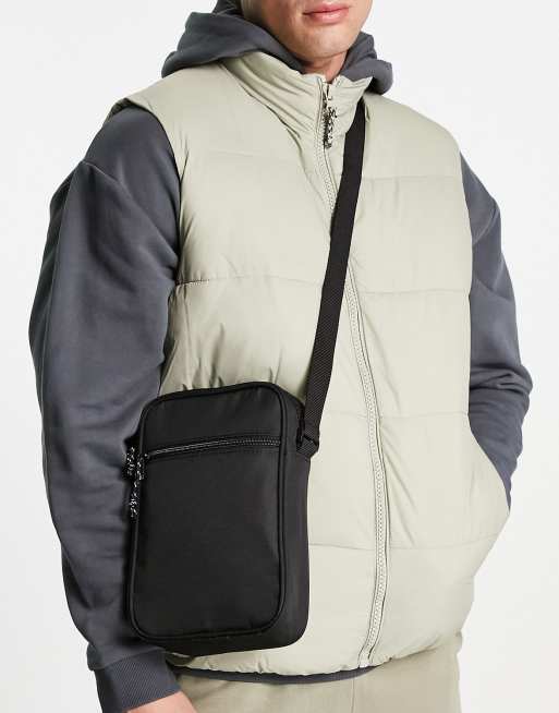 ASOS DESIGN cross body flight bag in black with contrast puller ASOS