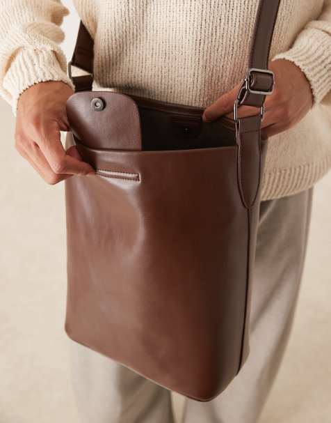 ASOS DESIGN cross body PU bucket bag in brown - view 2