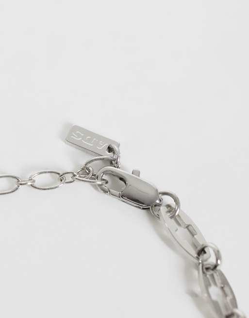 ASOS DESIGN cross cut out chain bracelet in silver, 2 of 3