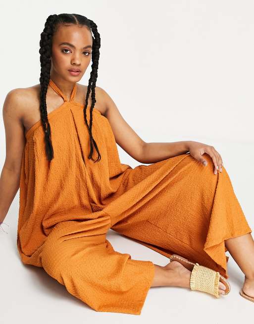 ASOS DESIGN cross neck textured swing bib jumpsuit in tobacco ASOS