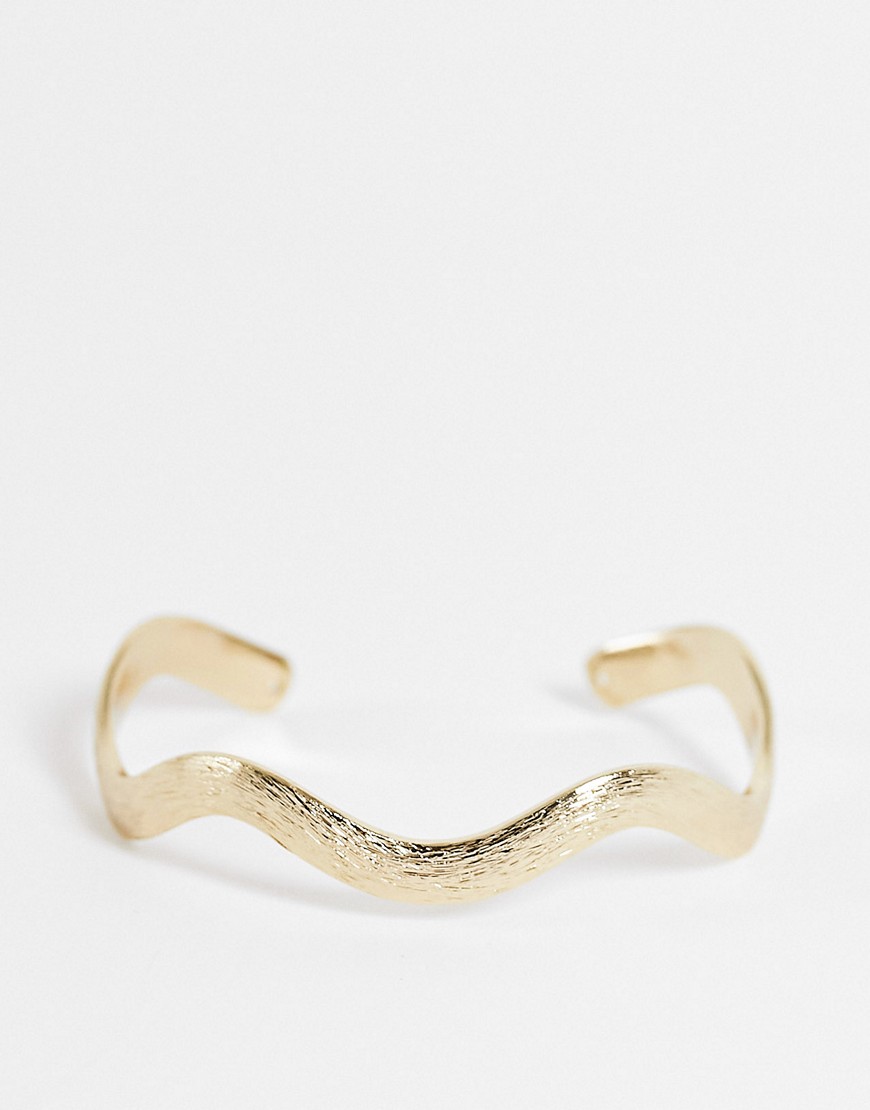 ASOS DESIGN cuff bracelet in wave design in gold tone