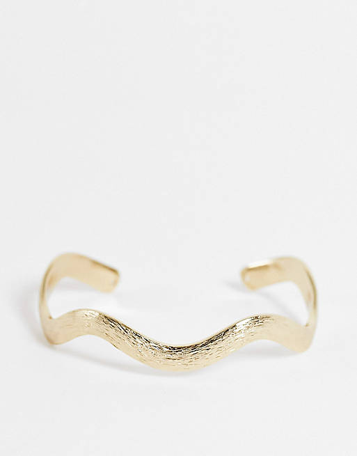 ASOS DESIGN cuff bracelet in wave design in gold tone