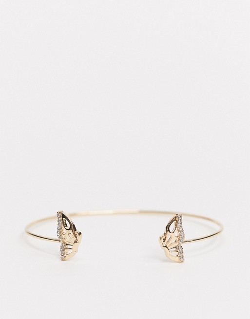 ASOS DESIGN cuff bracelet with butterfly ends in gold tone