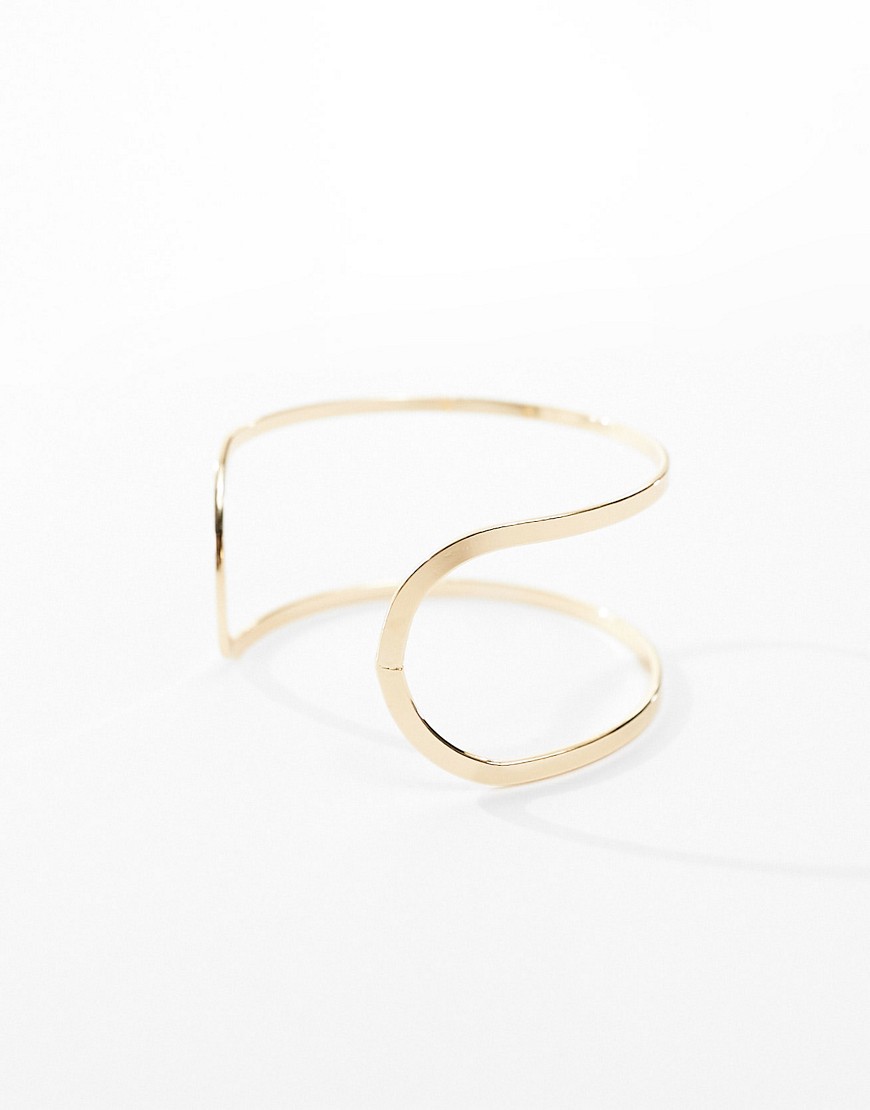 ASOS DESIGN cuff bracelet with cut out design in gold tone