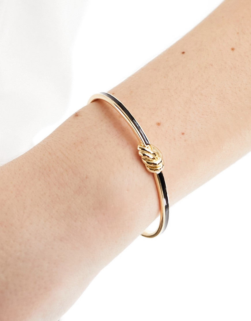 ASOS DESIGN cuff bracelet with enamel knot detail in gold tone