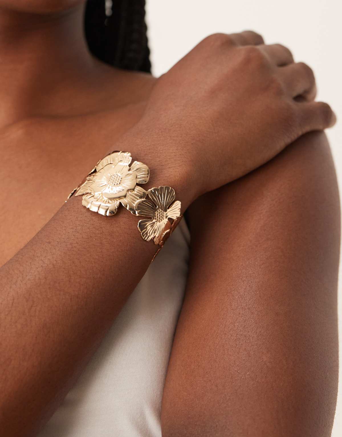 ASOS DESIGN cuff bracelet with floral detail in gold tone