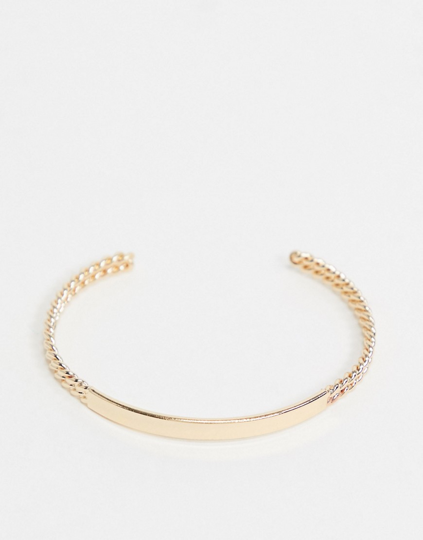ASOS DESIGN cuff bracelet with sleek front and double twist ends in gold tone