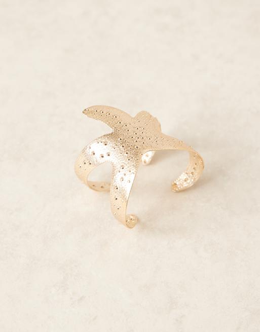 ASOS DESIGN cuff bracelet with starfish detail in gold tone, 2 of 3