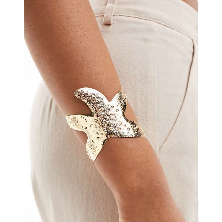 ASOS DESIGN cuff bracelet with textured starfish design in  display picture 1