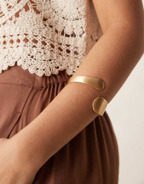 ASOS DESIGN cuff bracelet with wrap around brushed detail in gold tone - view 1