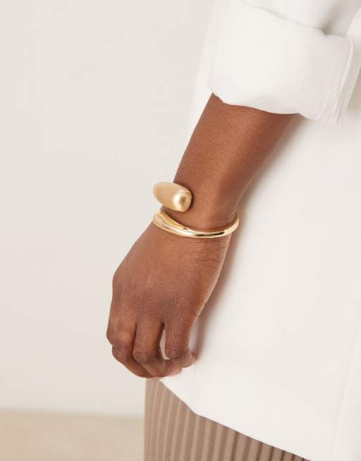ASOS DESIGN cuff bracelet with wrap around molten detail with shiny and brushed gold tone