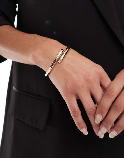 ASOS DESIGN cuff bracelet with wrap detail in gold tone - view 1