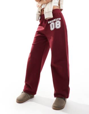 Asos Design Cuffed Jogger With Number Applique In Burgundy-Red