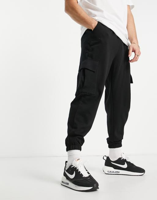 ASOS DESIGN cuffed joggers with cargo pockets in black - BLACK | ASOS