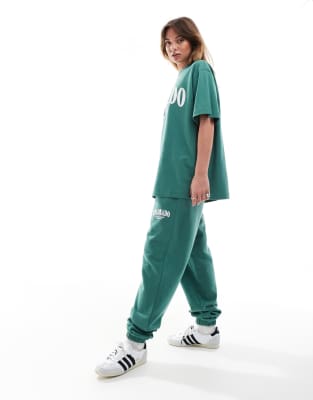 Asos Design Cuffed Sweatpants With Colorado Graphic Green