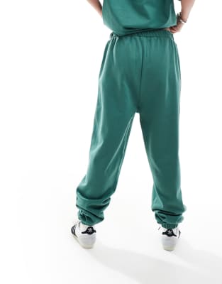 Asos Design Cuffed Sweatpants With Colorado Graphic Green In Green