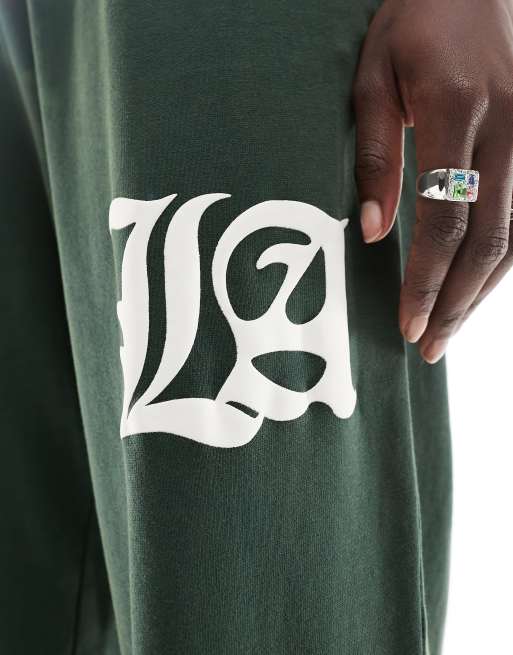 ASOS DESIGN cuffed sweatpants with LA graphic in washed green - part of a set, 3 of 5