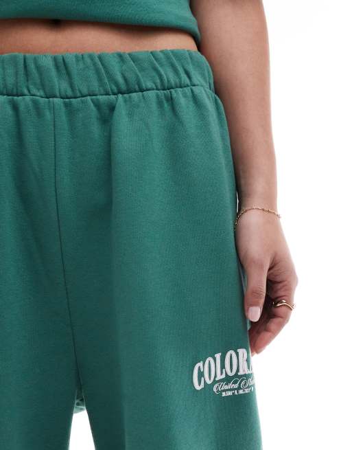 ASOS DESIGN cuffed trackies with Colorado graphic green, 3 of 5