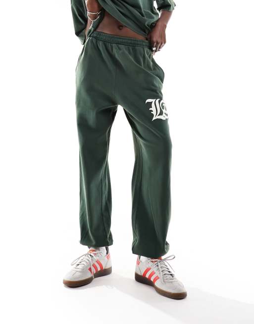 ASOS DESIGN cuffed trackies with LA graphic in washed green (part of a set), 2 of 5