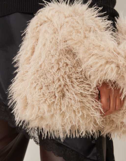 ASOS DESIGN curly faux-fur tote bag in cream