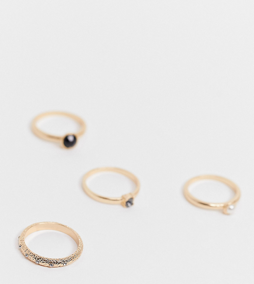 ASOS DESIGN Curve – 4-pack guldfärgade ringar med oäkta svarta stenar och pärlor