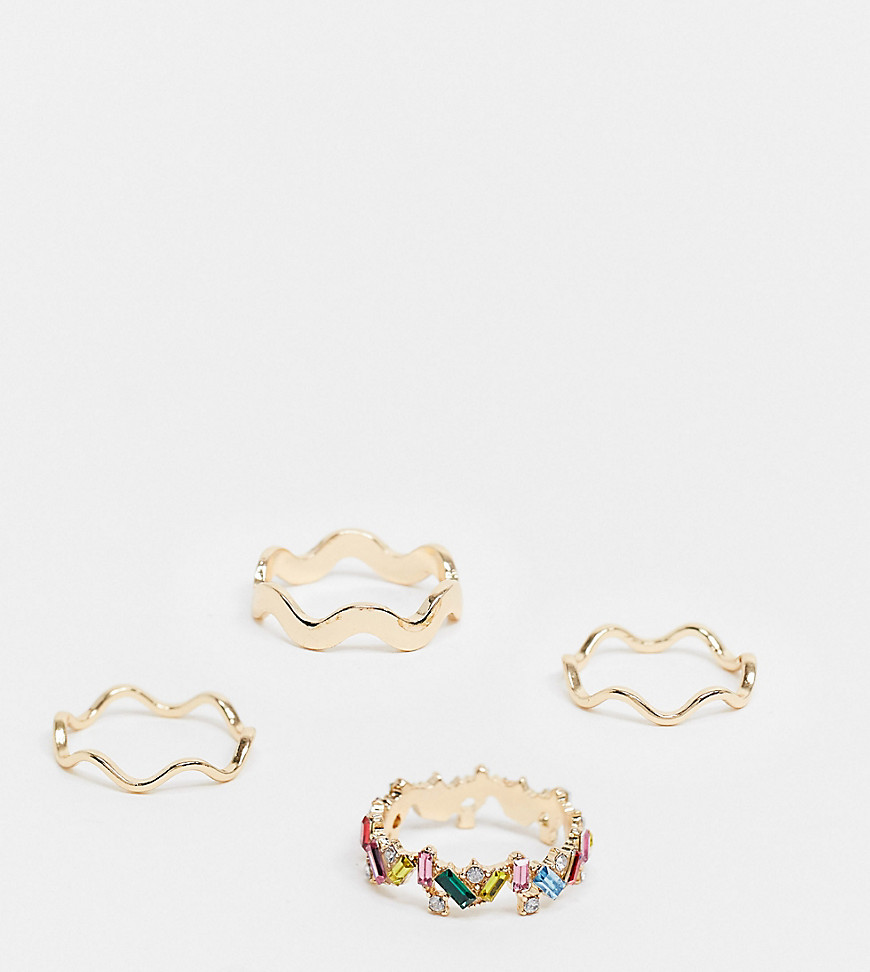 ASOS DESIGN Curve – 4-pack guldfärgade ringar med regnbågsfärgade stenar och sicksackdesign