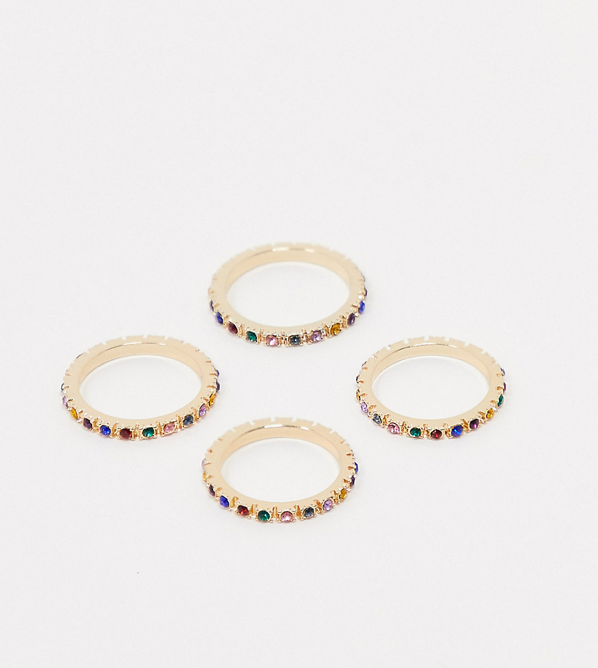 ASOS DESIGN Curve – 4-pack guldfärgade ringar med stenar i regnbågsfärger