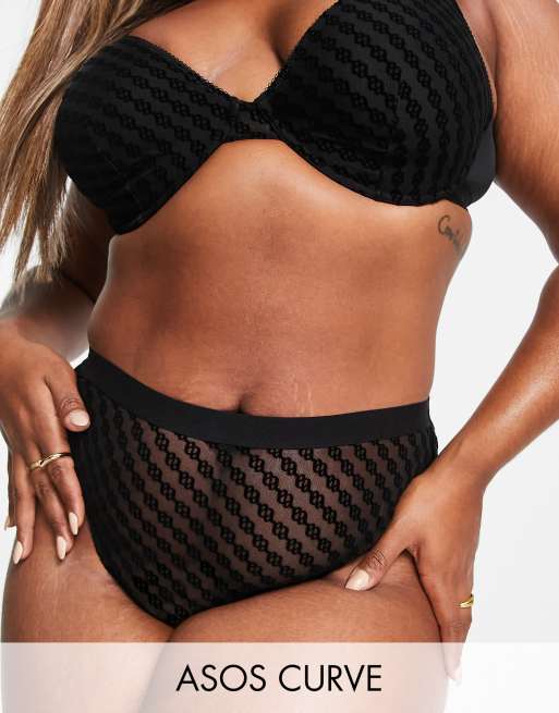 ASOS DESIGN Curve - Amelia - Slip a vita alta in rete con monogramma in tessuto floccato nero