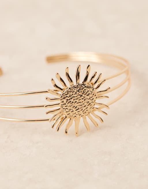 ASOS DESIGN Curve arm cuff with sun design in gold tone | ASOS