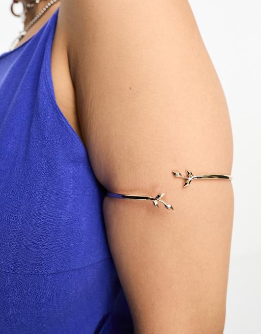 ASOS DESIGN Curve arm cuff with wraparound leaf design in gold tone